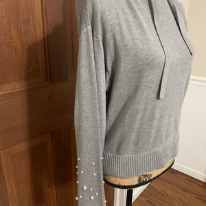 Elan grey hoodie with pearl detail.